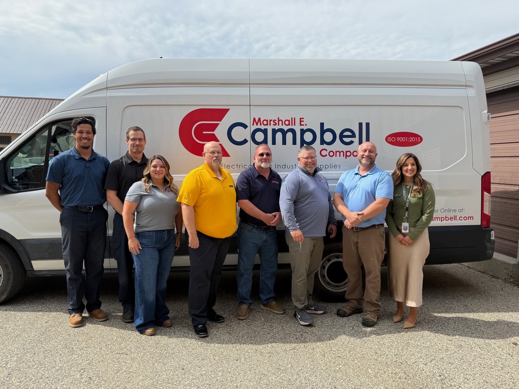 St Clair TEC representatives , Marshall E Campbell, and Stanley Black & Decker stand in front front of the Marshall E Campbell delivery van.