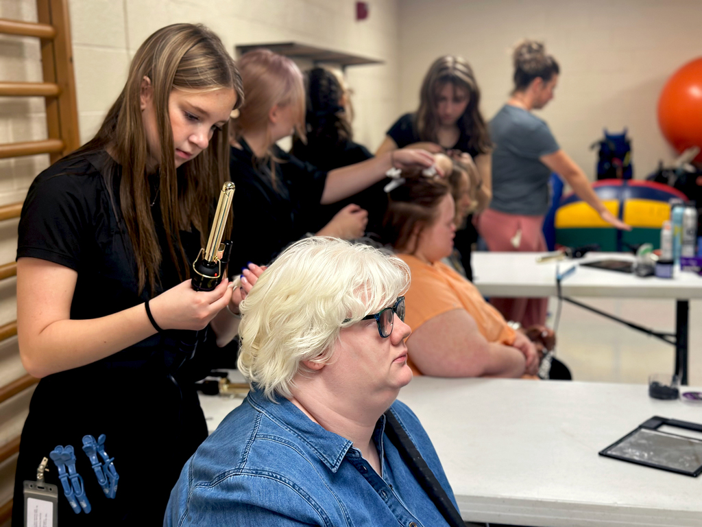 Woodland students getting their hair done by TEC students in preparation for Fash Bash