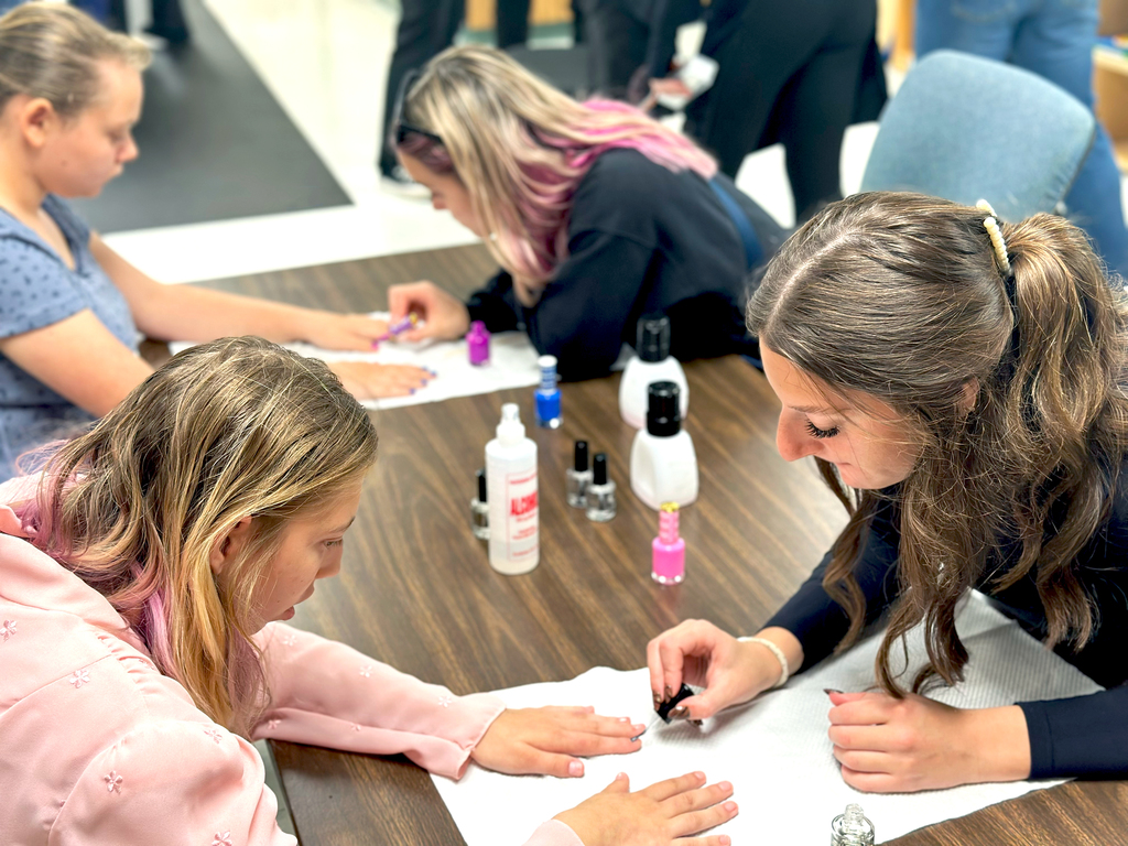 Woodland students getting their nails done by TEC students in preparation for Fash Bash