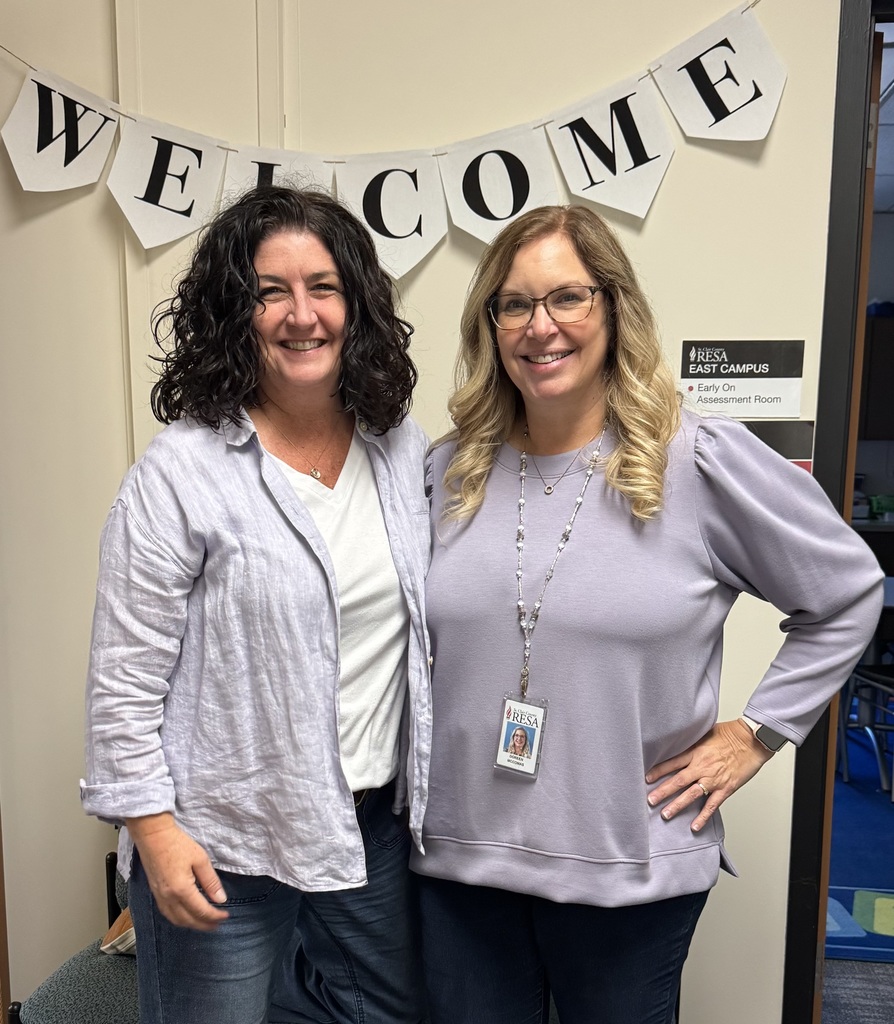 Jennifer Gunderson and Doreen McComas wearing purple