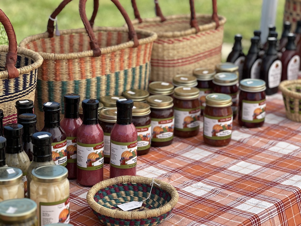 Jams, dressings, syrups, and baskets on display at the Woodland Fall Harvest