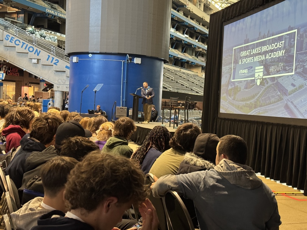 Students seated listen to a presenter at the Great Lakes Broadcast and Sports Media Academy