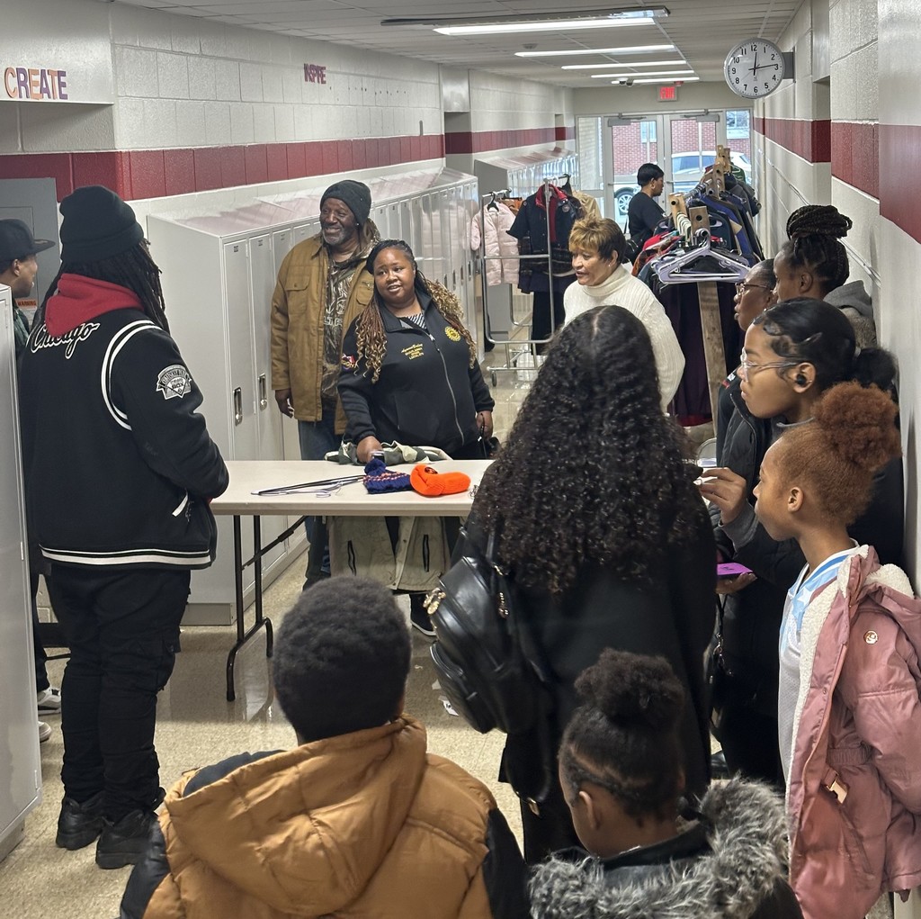 People wait in line to enter the Chili and Coats event