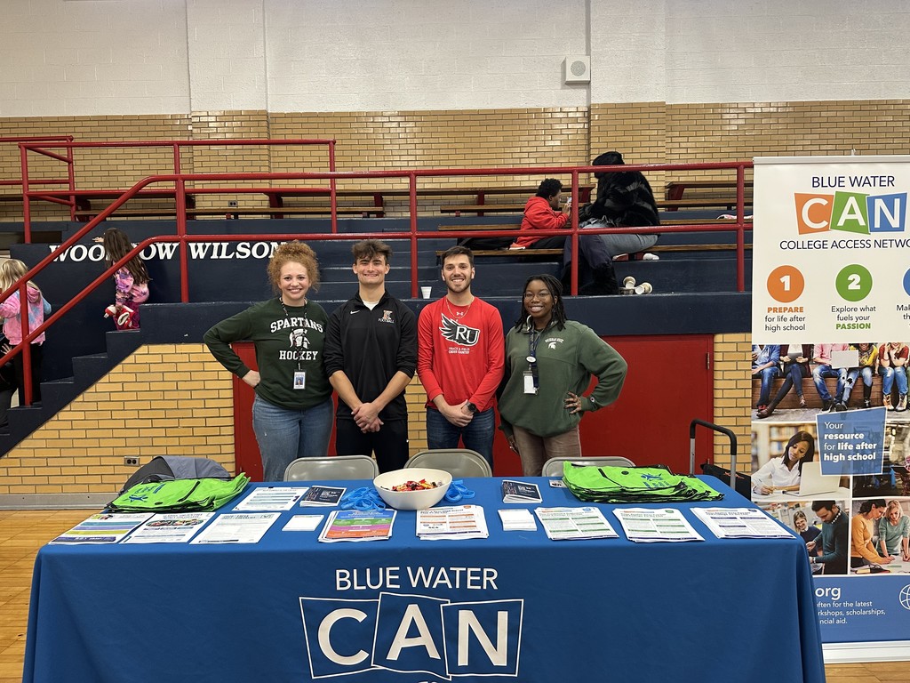 Erin Schweihofer stands with three of our college advisors