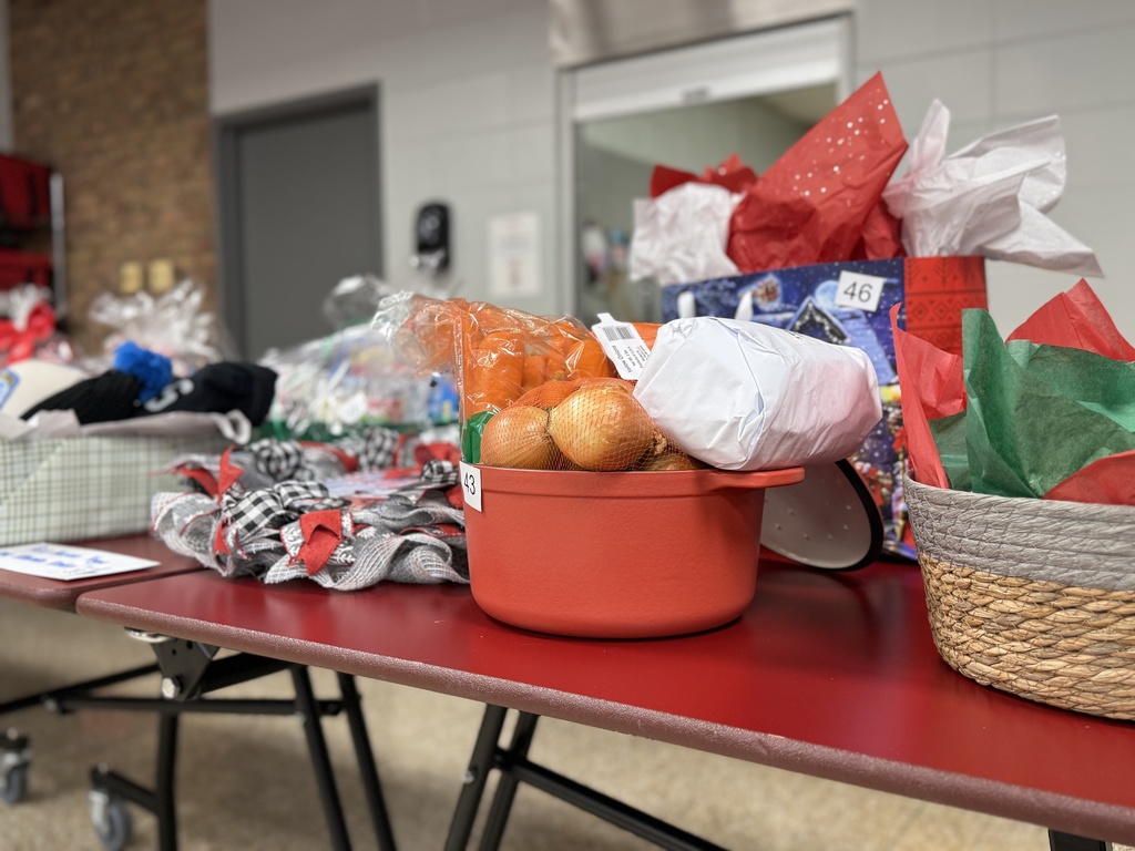 Raffle baskets are displayed on a table in the Woodland cafeteria during their annual Holiday Auction