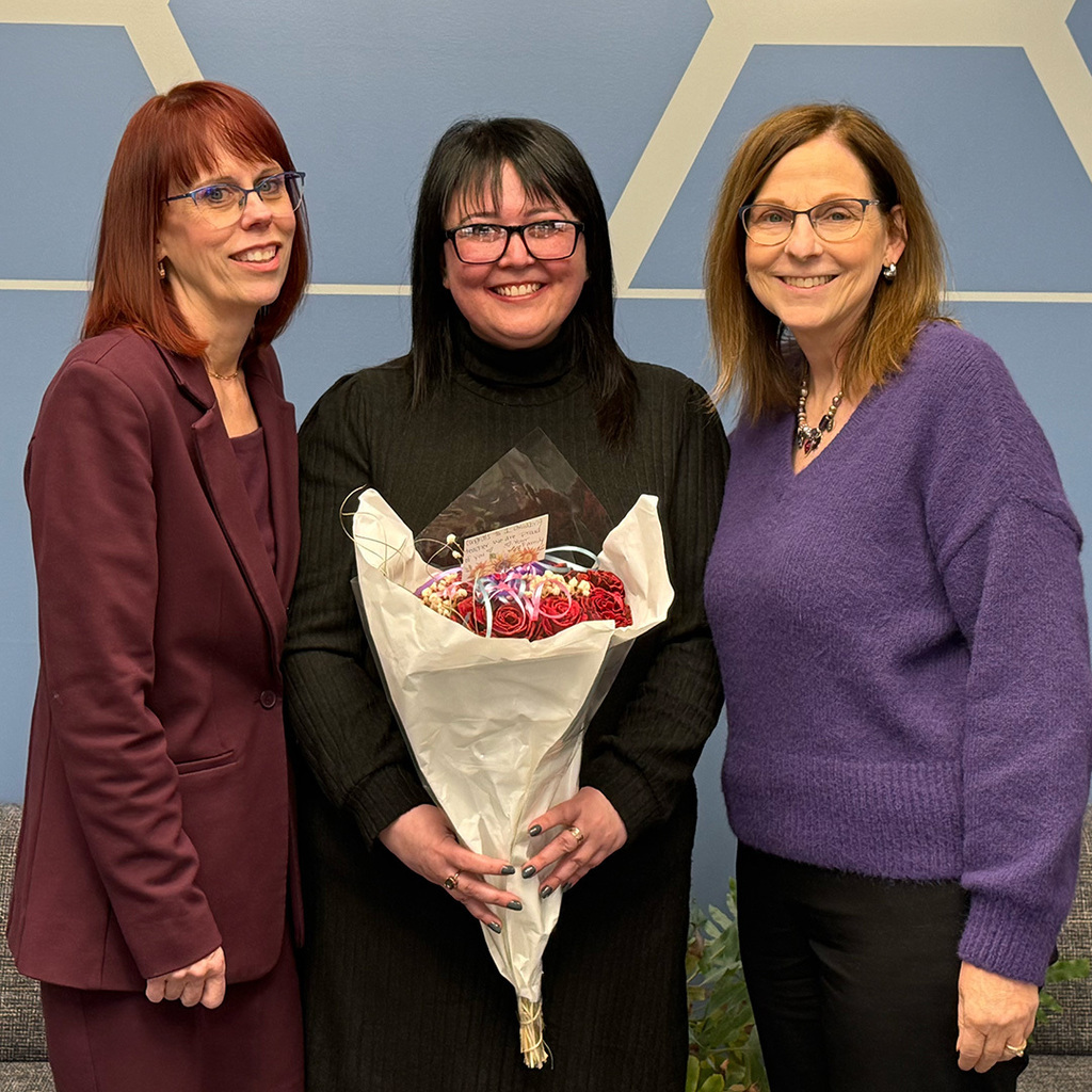 Angela Jackson poses with RESA Superintendent Brenda Tenniswood and RESA Director of Special Education Deana Tuczek