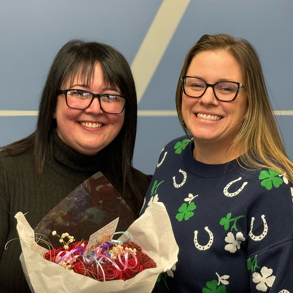 Angela Jackson stands with Woodland Developmental Center principal Cora Heyboer