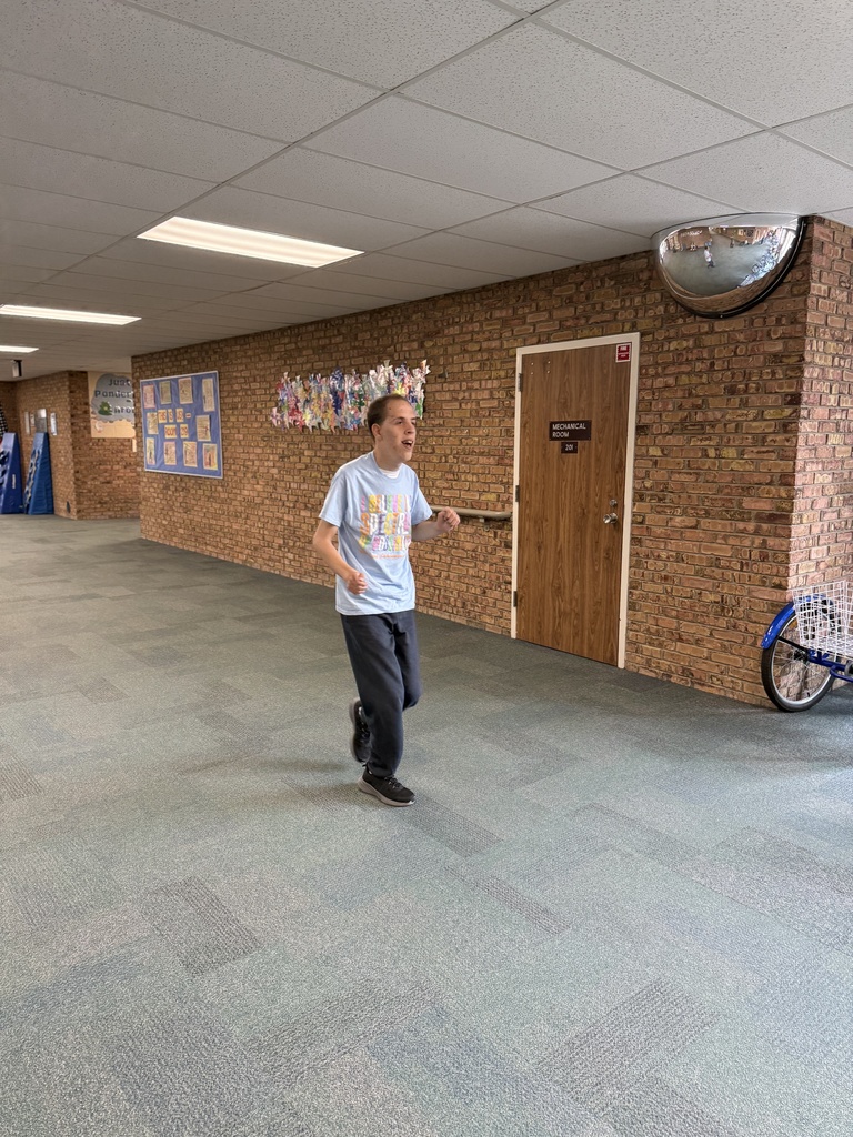 A student walks in the school hallway