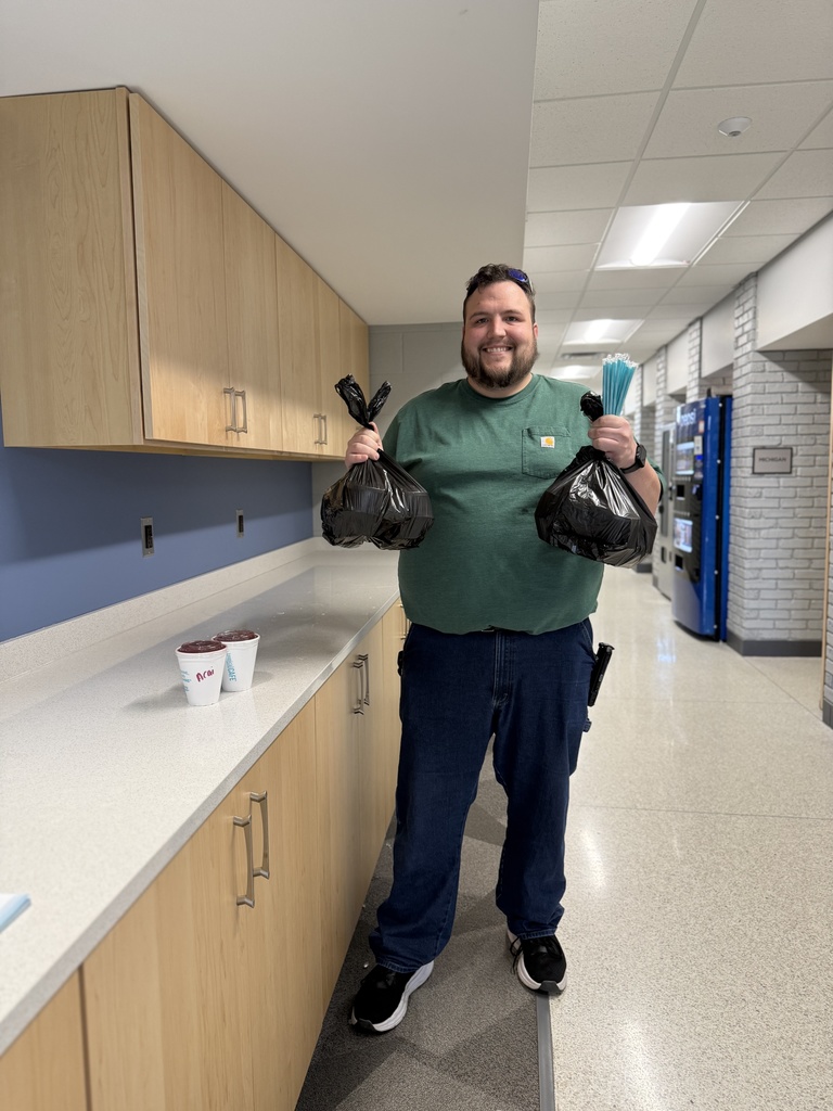 SCCRESA custodian Quentin holds bags of smoothies and straws as he gets ready to deliver them to staff