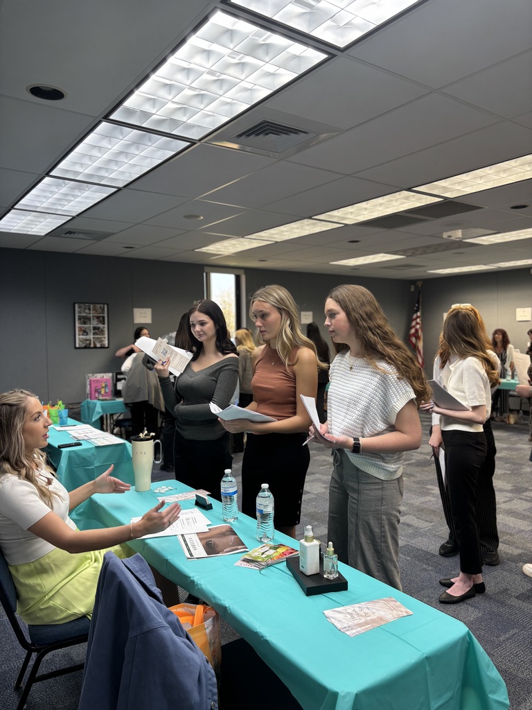 Photos of cosmetology students participating in a job fair.