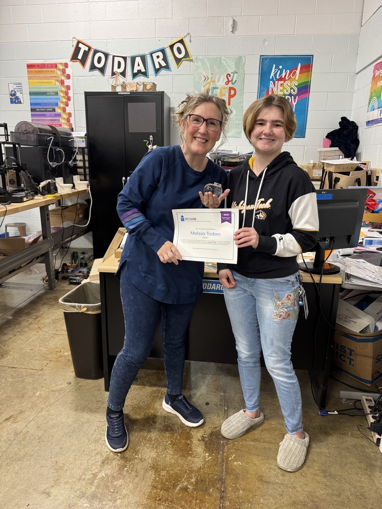 SCCASB scholarship recipient Katherine Emerson presents her St. Clair TEC Engineering and Robotics teacher, Melissa Todaro, with a certificate of appreciation.