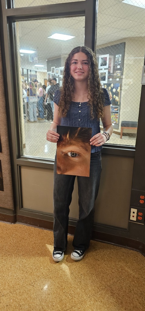 TEC student Layla Store holds her artwork