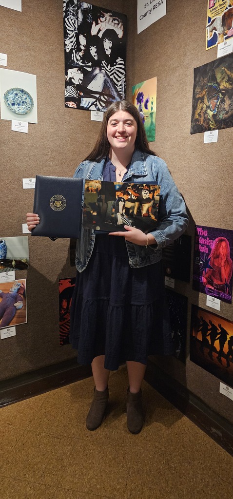 Raegan Horan holds her winning photo and certificate