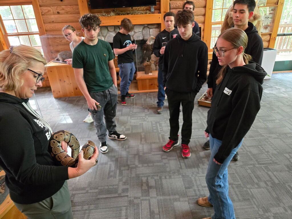 Law & Public Safety students seeing the snake at Pine River Nature Center
