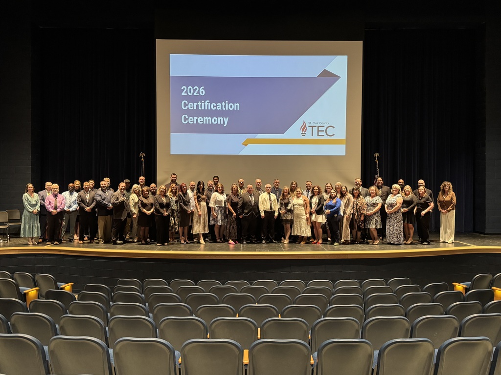 TEC stand on stage in front of a screen with the text, "2026 Certification Ceremony" during the school's certification ceremony on May 21.