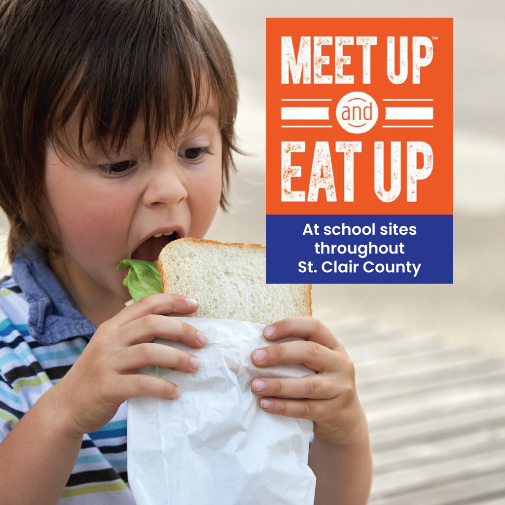 Child taking a big bite of a sandwich with text overlay reading, "Meet Up and Eat Up at school sites throughout St. Clair County,"
