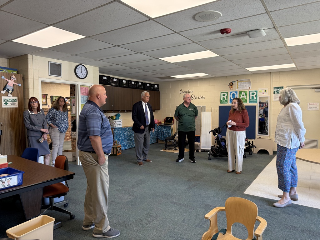 SCCRESA staff and board members stand in a classroom during a visit to Woodland Developmental Center