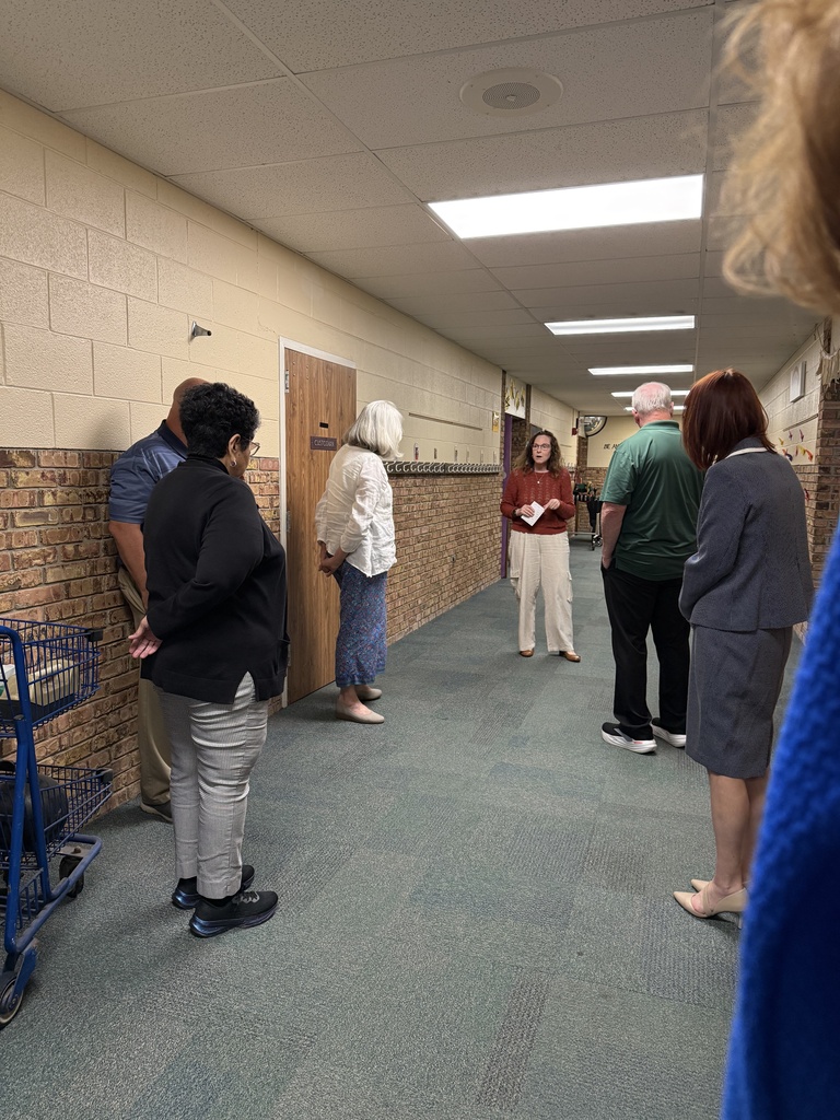 SCCRESA staff and board of education members stand in the hallway during a tour of Woodland Developmental Center