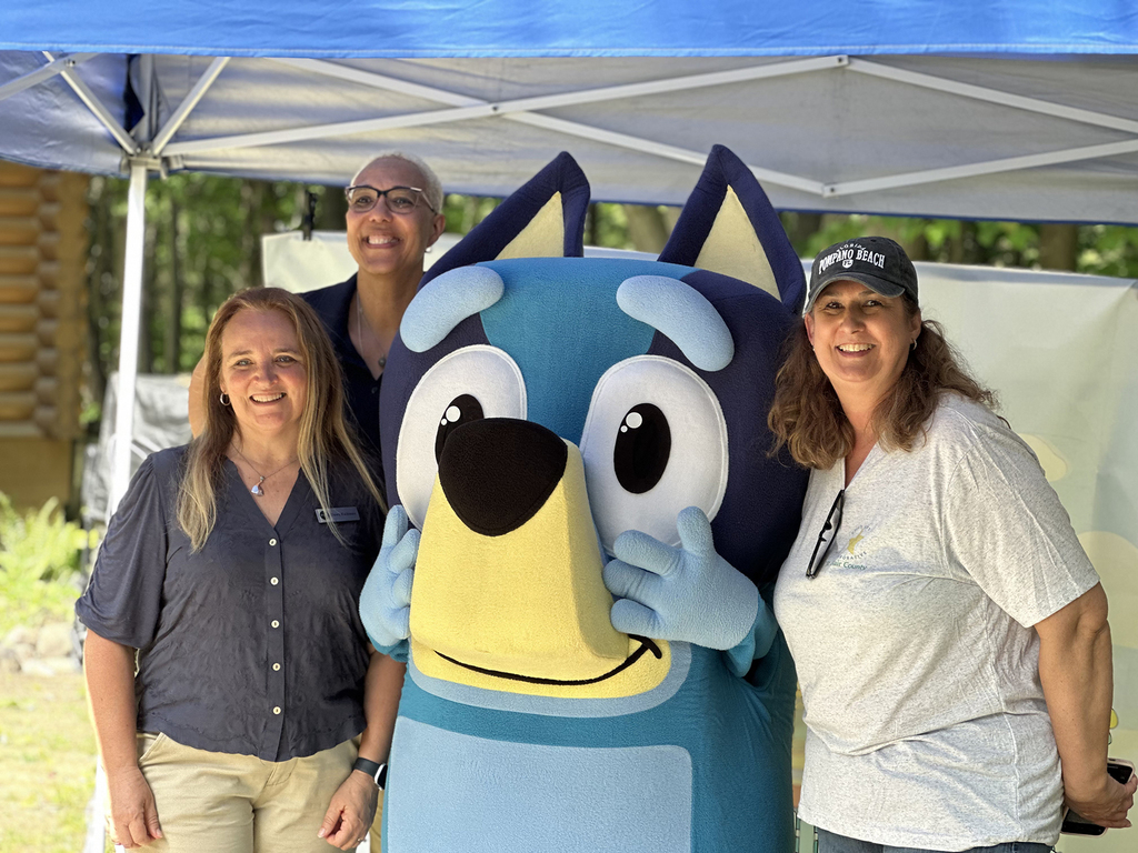 Bluey poses with MiLEAP representatives and RESA's Director of Early Childhood Services. 