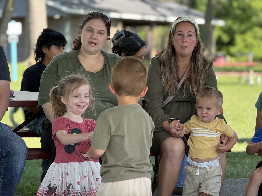Adults and children engaged in an activity during the PBS-sponsored activity