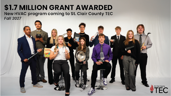 TEC students pose in a studio setting holding props from their individual programs of study
