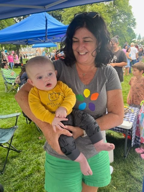 RESA Early Childhood Services staff member holds a baby at Family Night