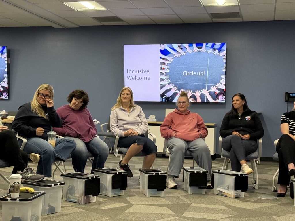 2nd Shift participants sit in a circle during a group discussion