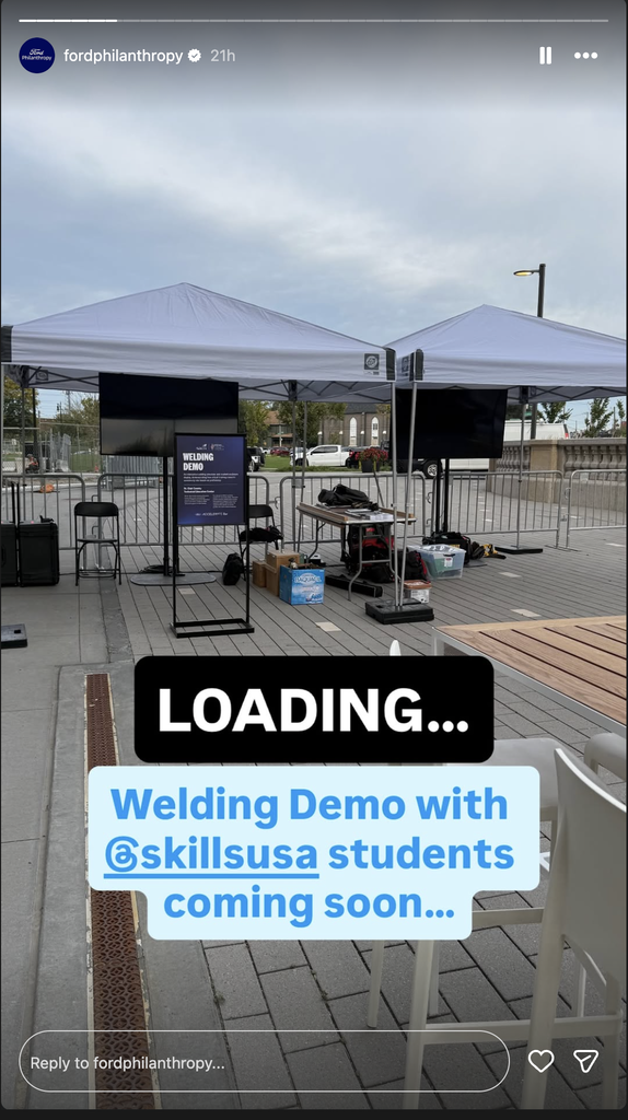 A canopy with a sign reading "Welding Demo"