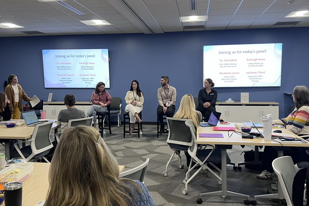 Deb Rosahk leads a panel discussion
