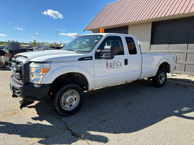 Ford F-250 Super Duty extended cab white truck 