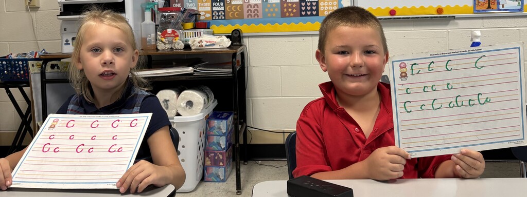 Boy with letter C handwriting