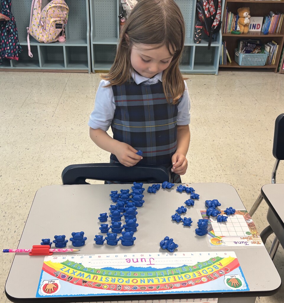 Girl sorting and counting blue bears
