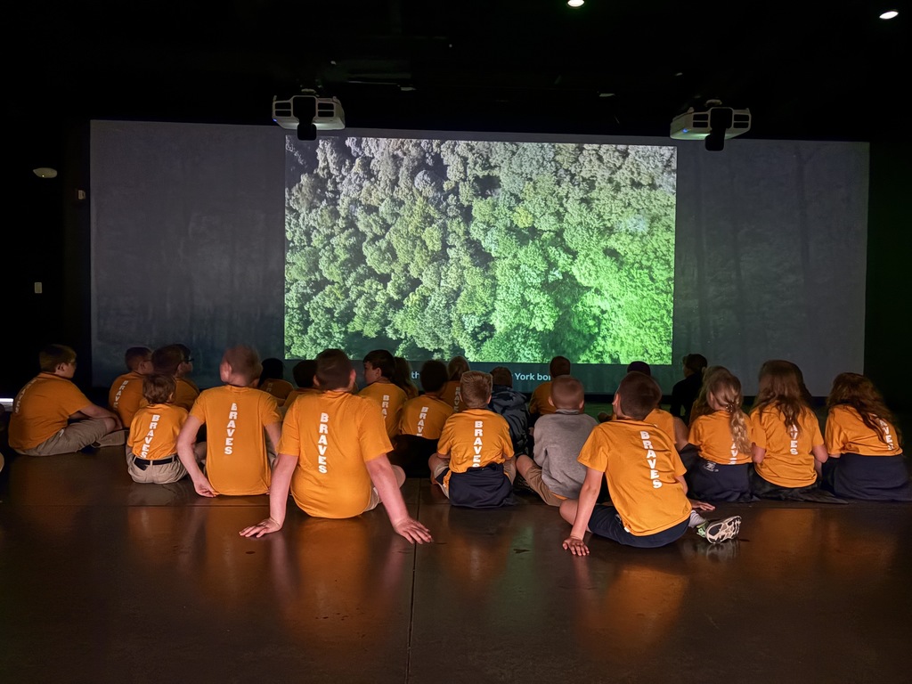 ST EDWARD 4th Grade STUDENTS  watching a video at THE SLUGGER MUSEUM