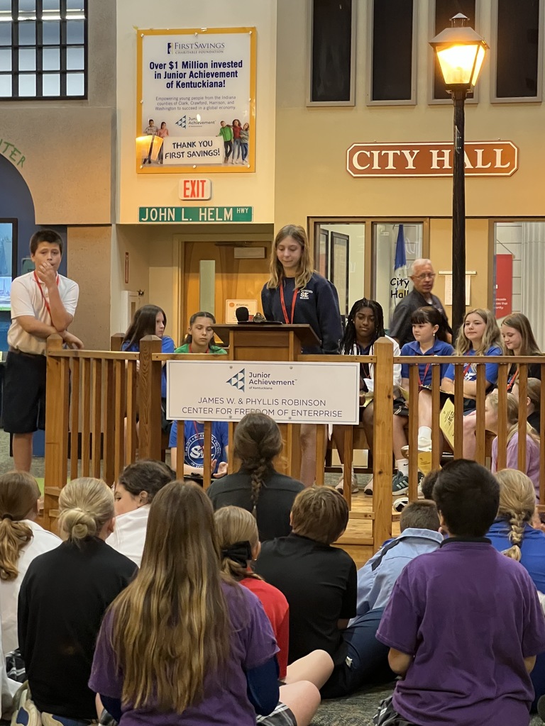 St Edward's 5th Grade students - podium picture with a girl