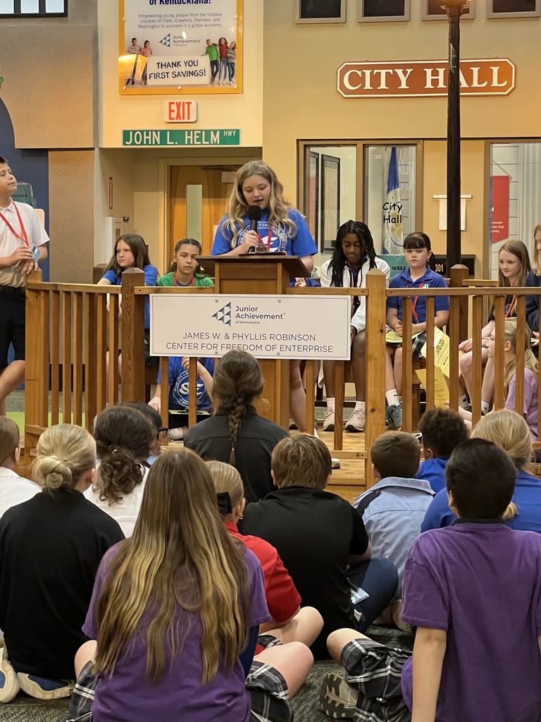 St Edward's 5th Grade students - podium picture of a student talking about a topic