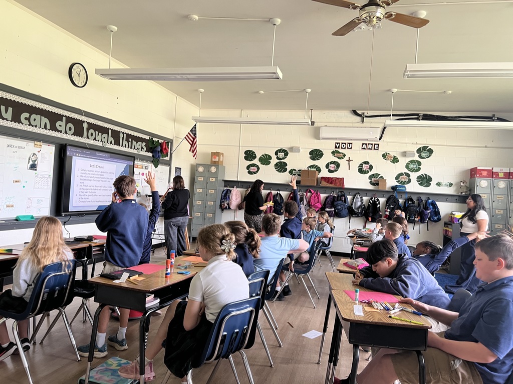 Bellarmine Students at St Edward’s designed and led lessons for our students in grades 2 through 5, Students participating in a classroom lesson.