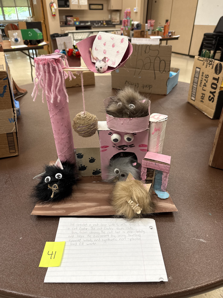 Recycled art project showing a cat tree made from craft materials.
