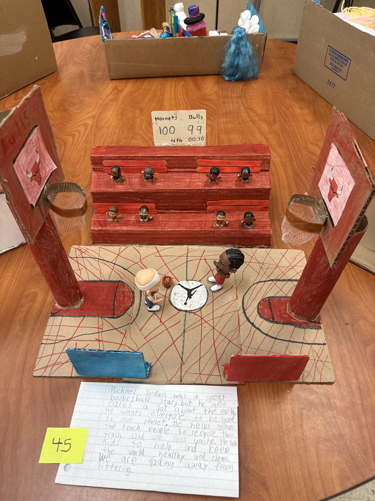 Recycled art project showing a miniature basketball court.