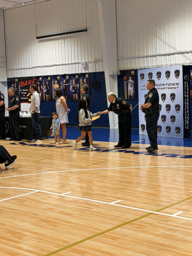 Student receiving a certificate during the ceremony.