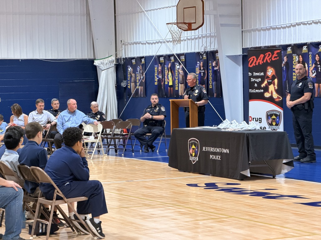 Police officer speaking during the D.A.R.E. graduation ceremony.