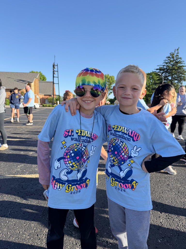Students smiling in Walkathon shirts.