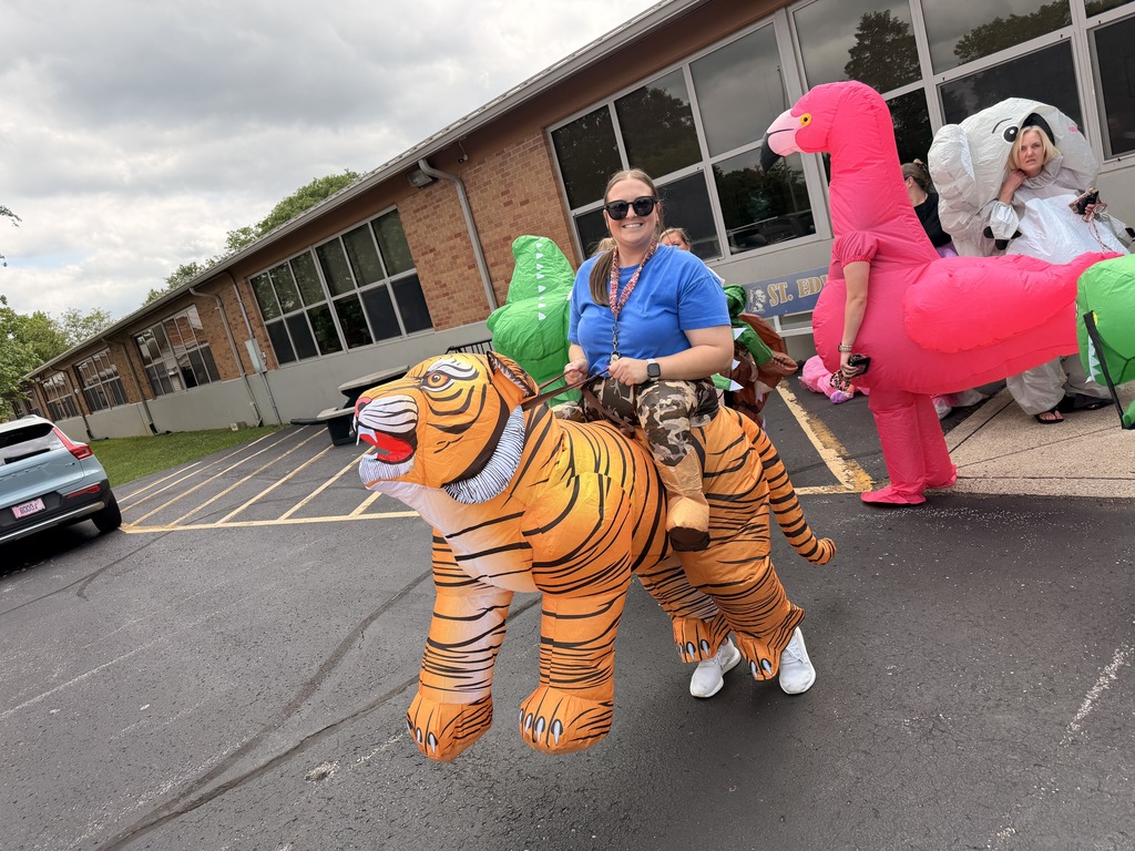 Staff member wearing an inflatable tiger costume.
