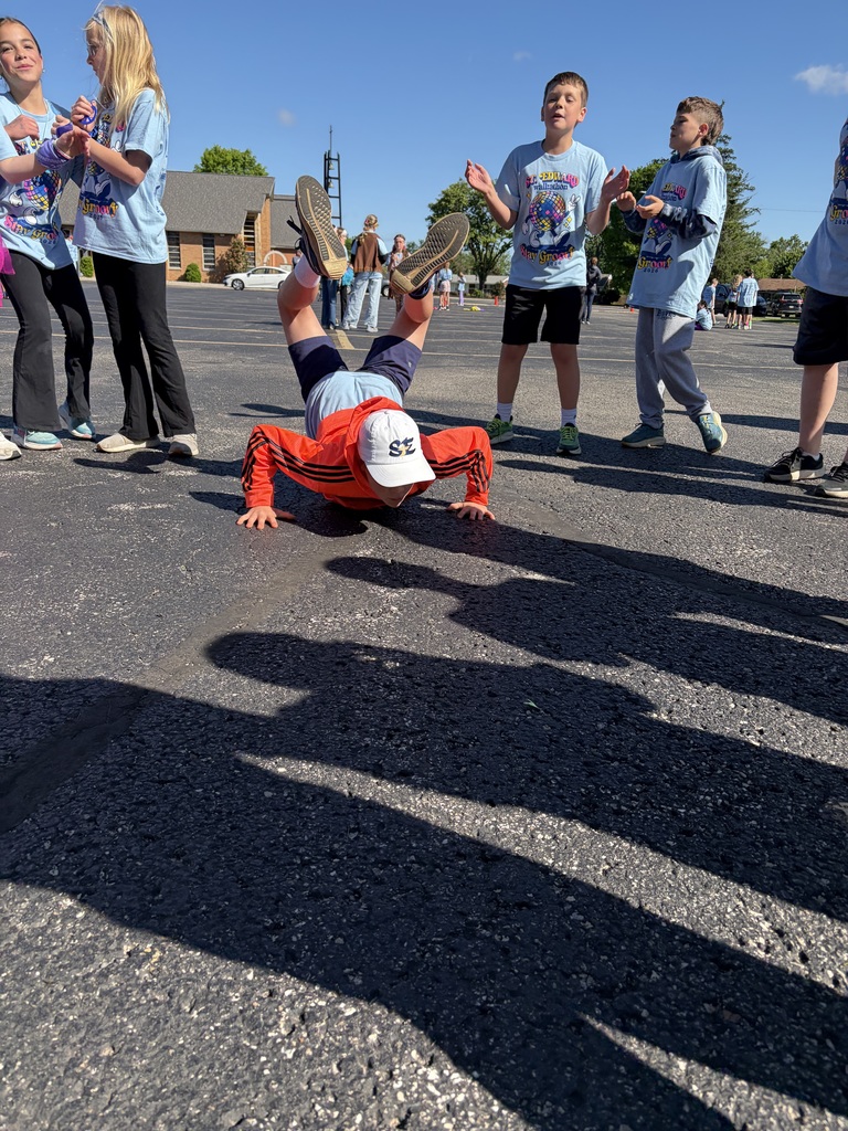 Student doing a push up during the Walkathon celebration.