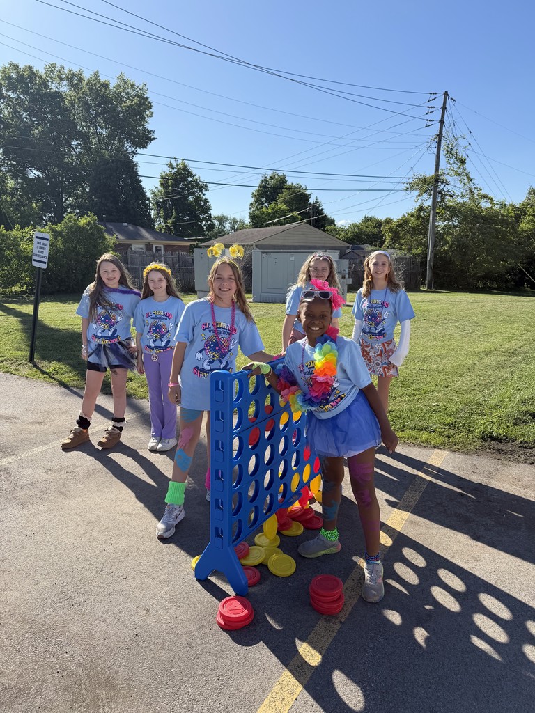 Students playing giant Connect Four outside.