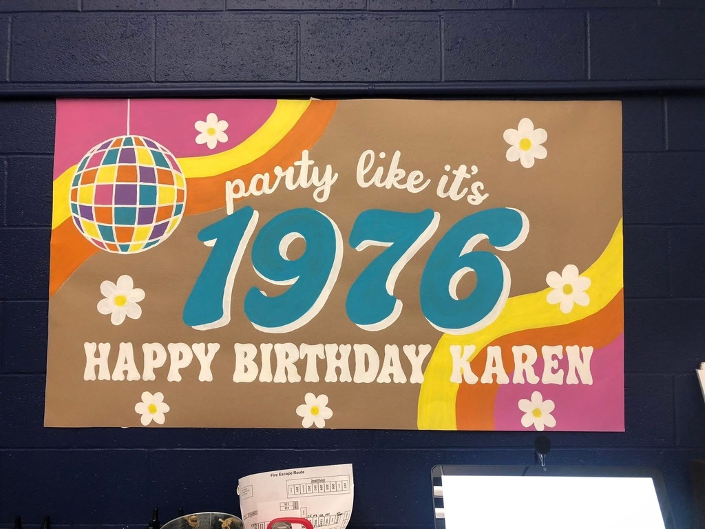 Colorful sign reading “Party like it’s 1976, Happy Birthday Karen.”