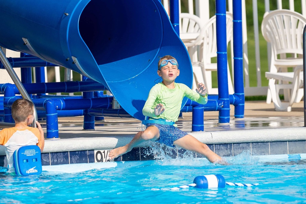 kid soaking in the sun at the pool