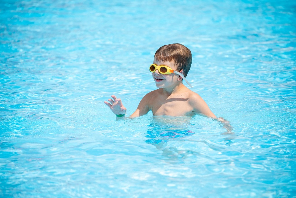 kids with goggles in the pool