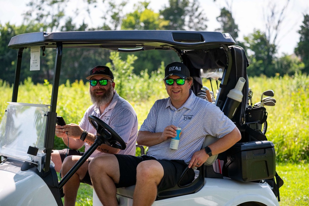 parents in the golf cart