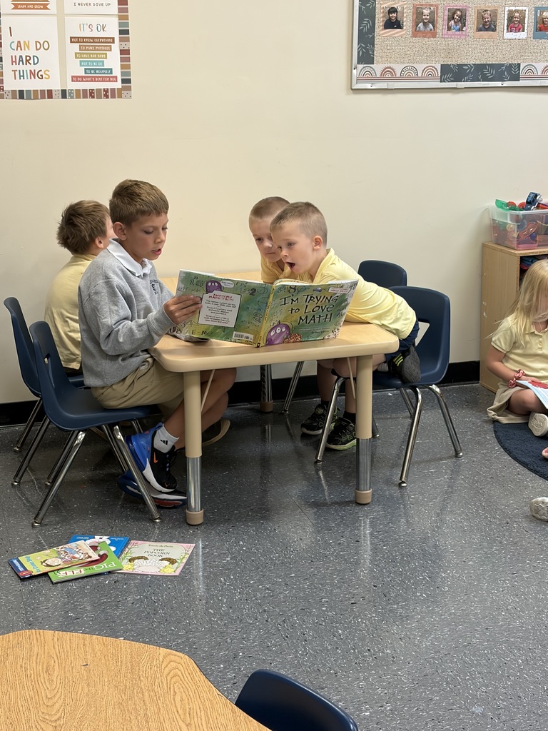 Older students read picture books with preschool students during Brave Buddies, sharing time together in the classroom and building friendships through reading.