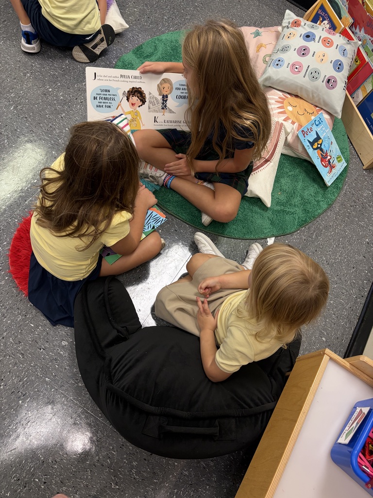 Older students read picture books with preschool students during Brave Buddies, sharing time together in the classroom and building friendships through reading.